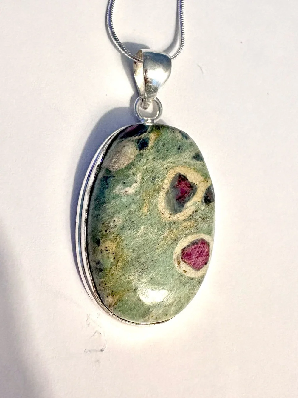 Beautiful, handcrafted, 2 inch Ruby Zoisite pendant on a silver chain.
